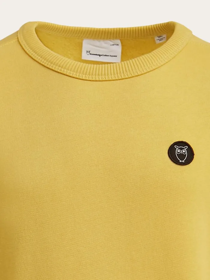 KnowledgeCotton Apparel Sweatshirts Badge Crew Neck Sweat Misted Yellow 8211 Kids KnowledgeCotton Apparel Sweatshirts Badge Crew Neck Sweat Misted Yellow 8211 Kids